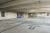 Inside a precast concrete parking garage with columns and beams.